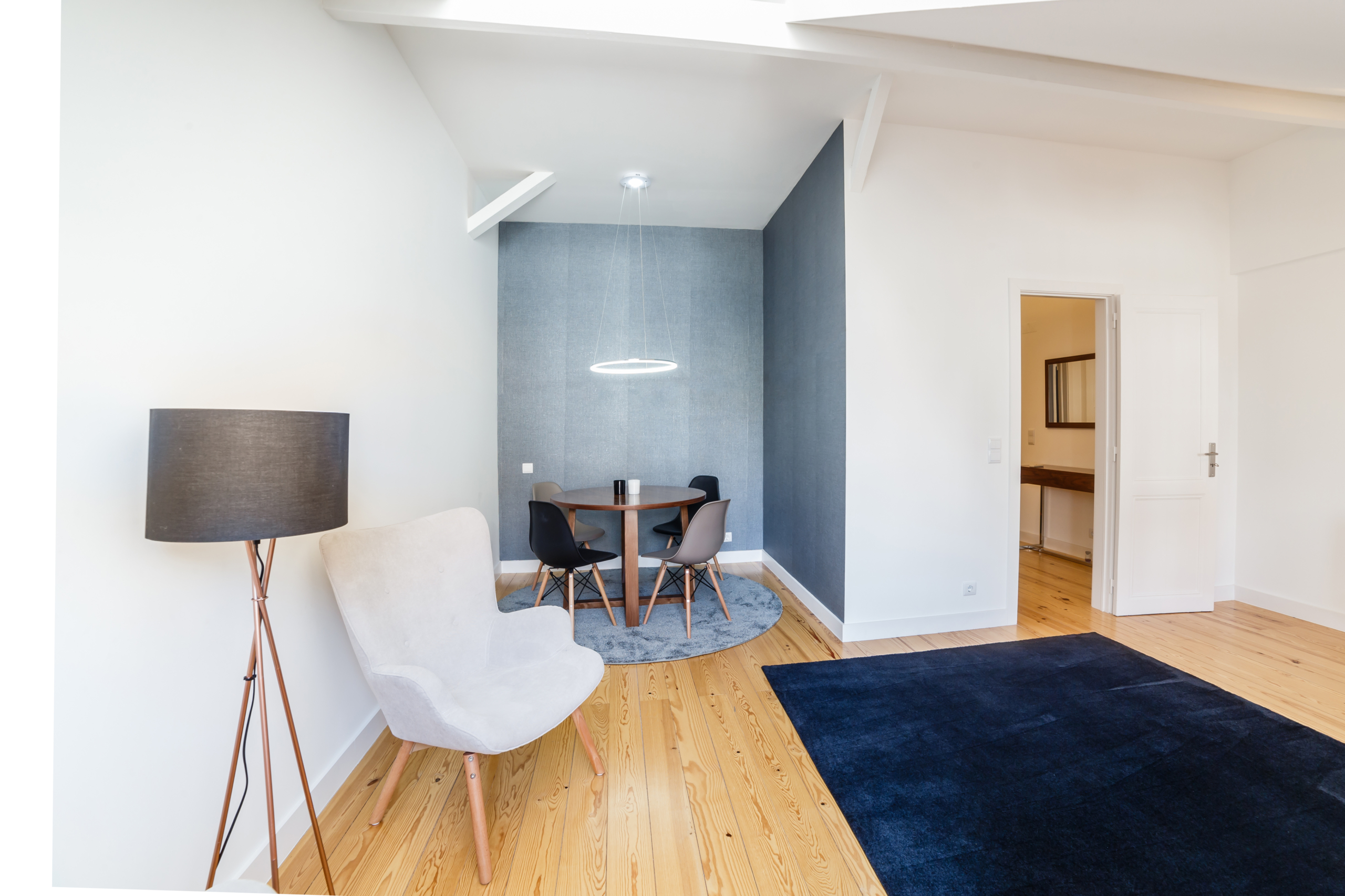 Modern apartment with white walls and light wooden floor Duplex apartment