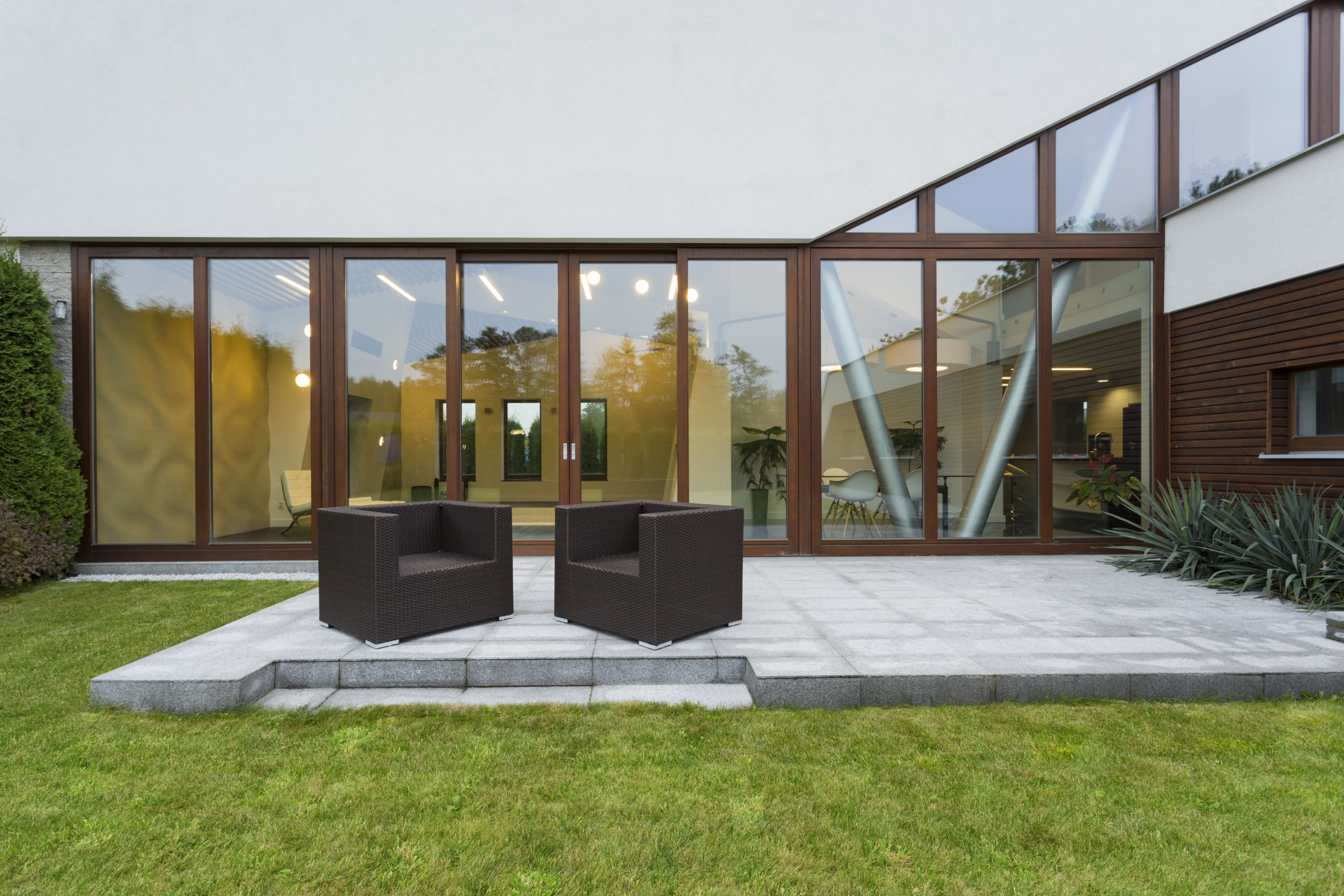 Villa patio with rattan chairs Three-bedroom family home